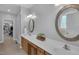 Spacious bathroom with double vanities, large mirrors, and ample counter space at 1 Plowlan Ct, Durham, NC 27707