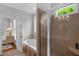 Bright bathroom with tub, glass shower, and a window providing natural light at 1 Plowlan Ct, Durham, NC 27707