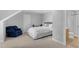 Cozy bedroom with a sitting area and an ensuite bathroom, perfect for relaxation and privacy at 1 Plowlan Ct, Durham, NC 27707