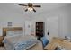Large bedroom featuring a desk, bookshelf, and blue-patterned bedding at 1 Plowlan Ct, Durham, NC 27707