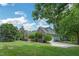 Beautiful home with a well-maintained lawn and an inviting driveway at 1 Plowlan Ct, Durham, NC 27707