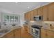 Stylish kitchen featuring stainless steel appliances, and ample counter space at 1 Plowlan Ct, Durham, NC 27707