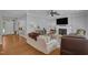 Cozy living room with fireplace, hardwood floors, and comfortable seating at 1 Plowlan Ct, Durham, NC 27707