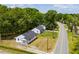 Beautiful aerial view of a house with a well-kept lawn, surrounded by mature trees and neighborhood streets at 1013 Graham St, Burlington, NC 27217