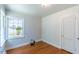 Bedroom with light walls and wood-look laminate flooring at 1013 Graham St, Burlington, NC 27217