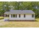 Charming single-story home featuring a classic brick foundation and neutral exterior with a well-maintained lawn at 1013 Graham St, Burlington, NC 27217