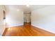 Bright living area showcasing sleek hardwood floors, neutral walls, and large window for natural light and modern feel at 1013 Graham St, Burlington, NC 27217