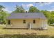 View of the rear exterior of this ranch home with siding, and a covered porch at 1013 Graham St, Burlington, NC 27217