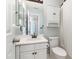 Bright bathroom with a single vanity, light blue walls and an alcove shower/tub combination at 102 Martins Point Pl, Cary, NC 27519