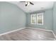 Bright bedroom with vaulted ceiling, ceiling fan, and two windows offering ample natural light at 102 Martins Point Pl, Cary, NC 27519