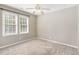 Bedroom with neutral carpet, and two windows offering ample natural light at 102 Martins Point Pl, Cary, NC 27519