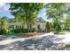 Charming clubhouse featuring an attractive entrance, well-kept landscaping, and ample parking at 102 Martins Point Pl, Cary, NC 27519