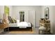 Neutral-toned bedroom with a woven bed frame, decorative pillows, and closet at 104 Corapeake Way, Apex, NC 27539