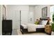 Well-lit bedroom featuring a modern bed, sliding closet doors, and attractive decor at 104 Corapeake Way, Apex, NC 27539