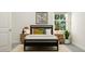 Cozy bedroom with a black bed frame, decorative pillows, and stylish wooden nightstands at 104 Corapeake Way, Apex, NC 27539
