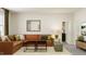 Comfortable living room with a large sectional sofa, modern tables, and decor at 104 Corapeake Way, Apex, NC 27539