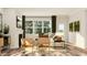 An inviting living room with a fireplace, plush sofa, and plenty of natural light at 104 Corapeake Way, Apex, NC 27539