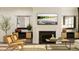 Stylish living room showcasing modern decor, fireplace, and decorative mirror accents at 104 Corapeake Way, Apex, NC 27539