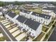 A bird's eye view shows townhomes with decks in a Primary-planned residential neighborhood at 104 Vallco Ln, Durham, NC 27713