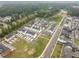 An aerial view of a sprawling residential community surrounded by lush trees and foliage at 104 Vallco Ln, Durham, NC 27713