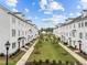 Community features a central green space, sidewalks, and attractive home exteriors at 104 Vallco Ln, Durham, NC 27713