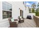 View of the back deck featuring outdoor seating, grill, and sliding glass doors at 104 Vallco Ln, Durham, NC 27713