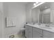 Bright bathroom showcasing a double vanity, a large mirror, and clean white fixtures at 104 Vallco Ln, Durham, NC 27713