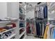 Walk-in closet with custom shelving and hanging racks for organized storage at 104 Vallco Ln, Durham, NC 27713