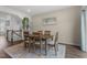 Comfortable dining area featuring stairs, modern decor, and neutral paint colors at 104 Vallco Ln, Durham, NC 27713