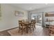 Cozy dining area adjacent to the kitchen, featuring an outdoor patio access and plenty of natural light at 104 Vallco Ln, Durham, NC 27713