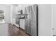 Modern kitchen featuring stainless steel appliances, a gas range, white cabinetry, and wood plank flooring at 104 Vallco Ln, Durham, NC 27713