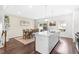 Lovely kitchen featuring an island with barstool seating, stainless appliances, and sliding door access to the outdoor patio at 104 Vallco Ln, Durham, NC 27713