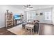 Bright living room featuring a comfy couch, entertainment center, and natural light at 104 Vallco Ln, Durham, NC 27713
