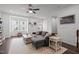 Inviting living room featuring a cozy couch, area rug, and an abundance of natural light at 104 Vallco Ln, Durham, NC 27713
