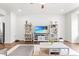 Cozy living room with an entertainment center and a ceiling fan, offering a relaxed atmosphere at 104 Vallco Ln, Durham, NC 27713