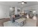 Relaxing living room with comfortable couch, area rug, stairs and open floor plan at 104 Vallco Ln, Durham, NC 27713