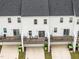 Back view of townhomes with small private decks and patios for outdoor living at 104 Vallco Ln, Durham, NC 27713