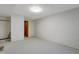 Unfinished basement featuring neutral carpet, and a door at 106 Argyle Ct, Garner, NC 27529