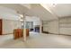 Large basement space with neutral carpet, fireplace, and a piano at 106 Argyle Ct, Garner, NC 27529