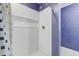 Bathroom shower stall has white tile, alcove, and blue accent wall at 106 Argyle Ct, Garner, NC 27529