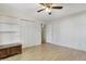 Bedroom features wood laminate floors, ceiling fan, and closet at 106 Argyle Ct, Garner, NC 27529