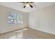 Bedroom with wood laminate floors, ceiling fan, and bright natural light at 106 Argyle Ct, Garner, NC 27529