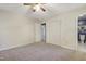 Bedroom features plush carpet, ceiling fan, closet, and adjacent bathroom at 106 Argyle Ct, Garner, NC 27529