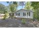 Inviting one-story home with vinyl siding, a brick accent, and a small front yard with landscaping at 106 Argyle Ct, Garner, NC 27529