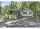 Attractive one-story home with a mix of brick and siding, complemented by a walkway and budding plants at 106 Argyle Ct, Garner, NC 27529