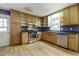 Functional kitchen featuring wood cabinets, stainless steel appliances, and a window for natural light at 106 Argyle Ct, Garner, NC 27529