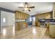Open kitchen boasts wood cabinets, stainless steel appliances, and hardwood flooring at 106 Argyle Ct, Garner, NC 27529