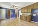 Cozy eat-in kitchen featuring wood cabinets with a mix of open and closed storage at 106 Argyle Ct, Garner, NC 27529