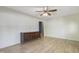 Spacious living room featuring laminate flooring, a ceiling fan, and neutral-toned walls at 106 Argyle Ct, Garner, NC 27529