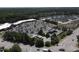 Overhead shot of neighborhood street, shopping center, retail and rows of green trees at 106 Argyle Ct, Garner, NC 27529
